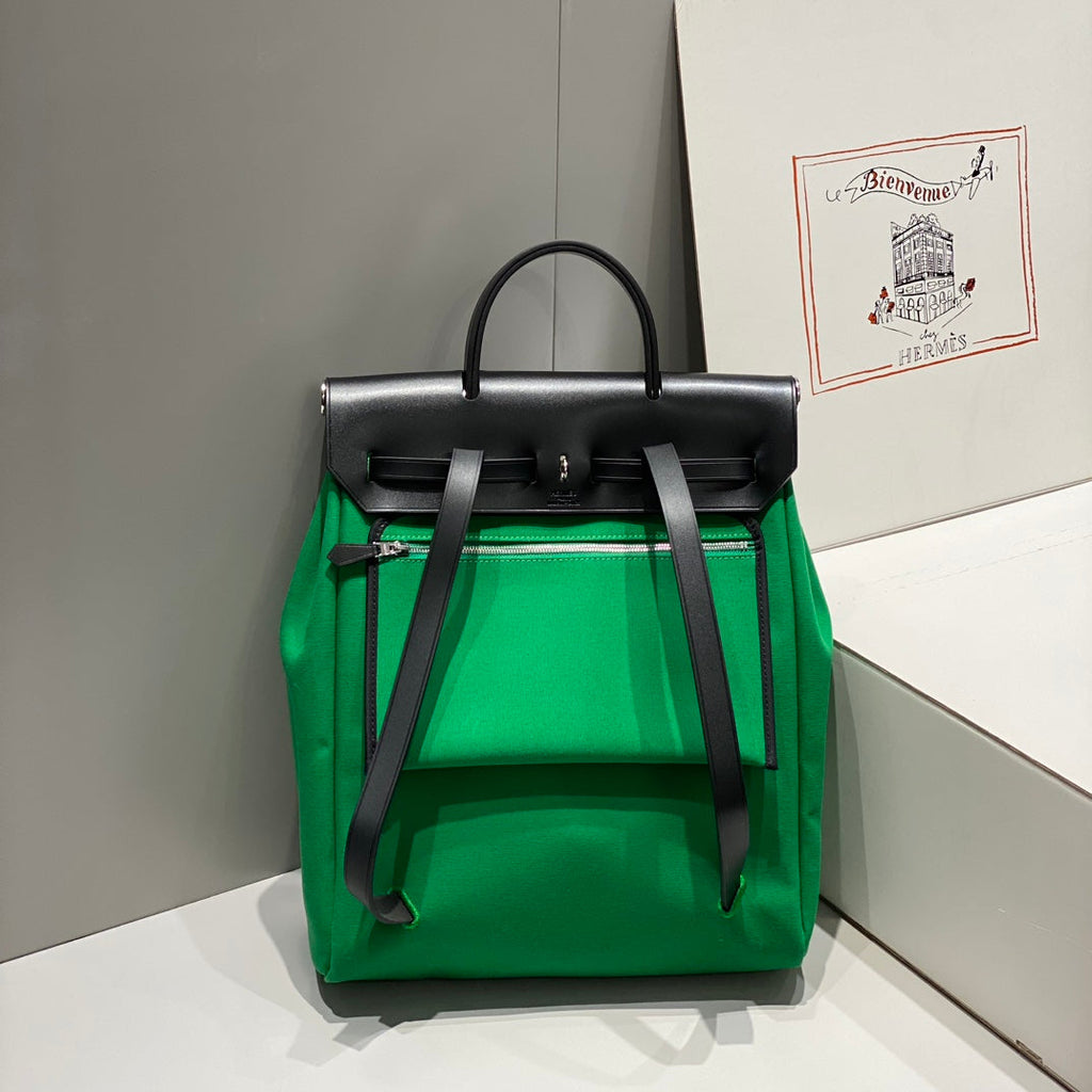 HERMES HERBAG A DOS ZIP RETOURNE BACKPACK 29 IN GREEN CANVAS AND BLACK CALFSKIN