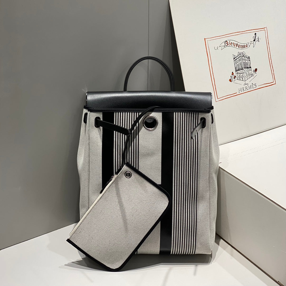 HERMES HERBAG A DOS ZIP RETOURNE BACKPACK 29 IN OFF-WHITE MIX BLACK CANVAS AND CALFSKIN
