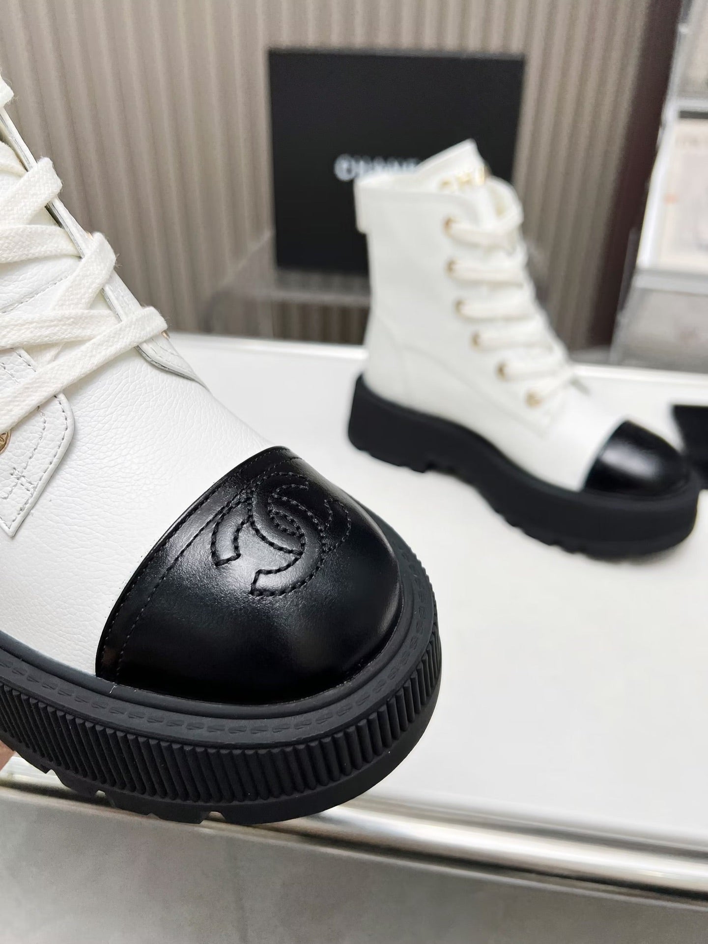 CHANEL SHORT BOOTS IN WHITE MIX BLACK COWHIDE