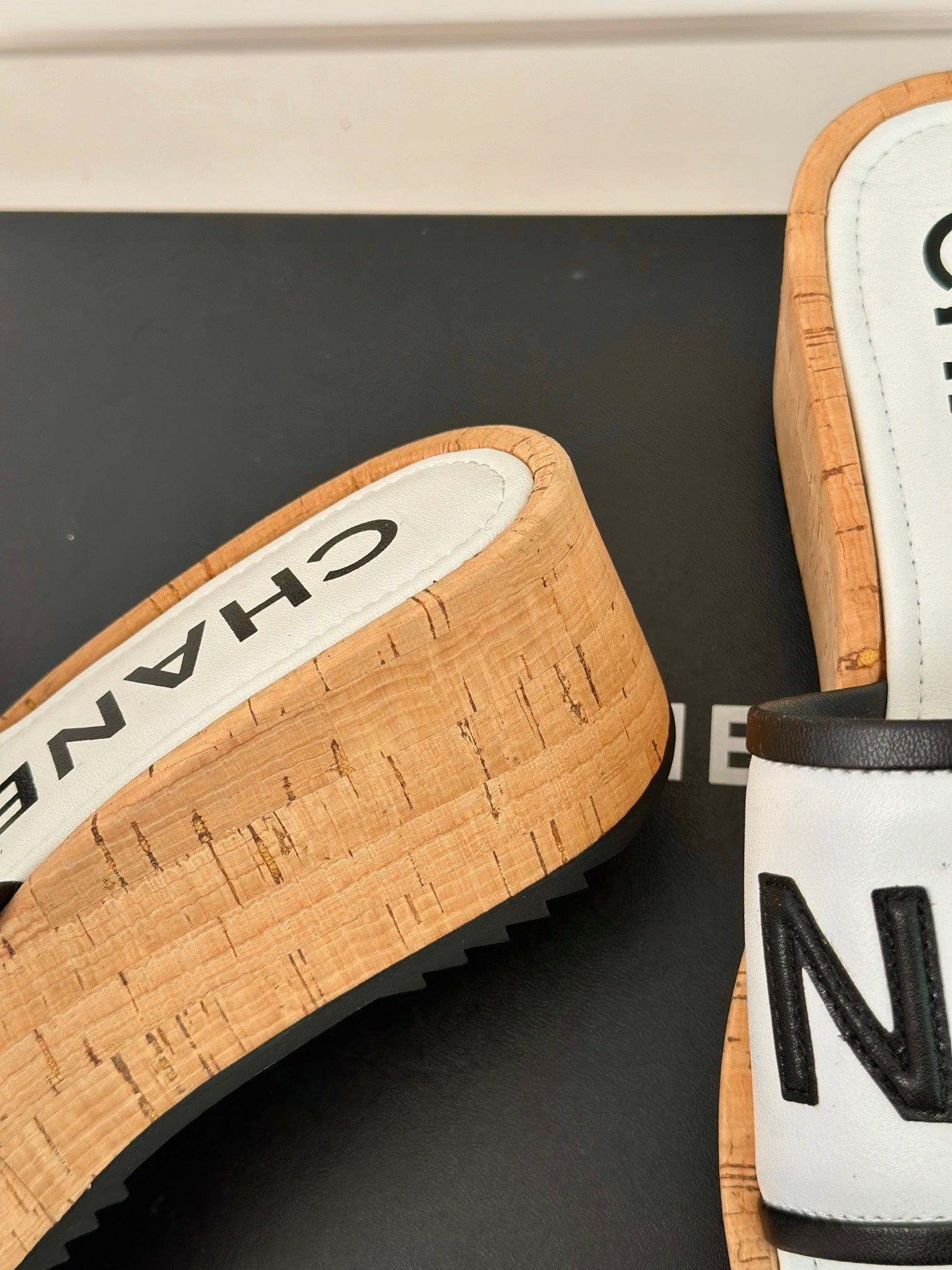 CHANEL THICK SOLE LETTER SLIPPERS IN WHITE SHEEPSKIN