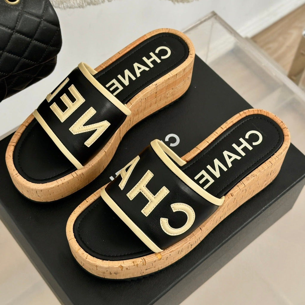 CHANEL THICK SOLE LETTER SLIPPERS IN BLACK SHEEPSKIN